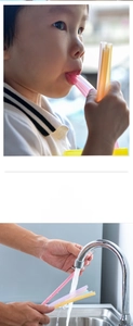 Detail of colorful food-grade silicone straws with cleaning brush for kids' safe drinking