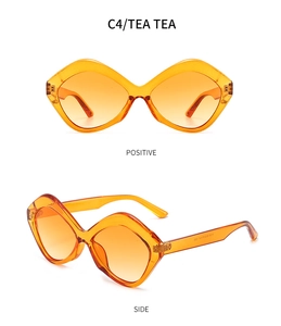 Detail of tortoiseshell geometric cat-eye sunglasses with orange gradient lenses