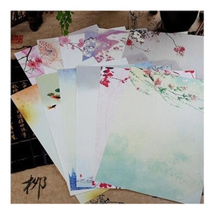 Collection of traditional Chinese ink painting stationery with floral and fish patterns