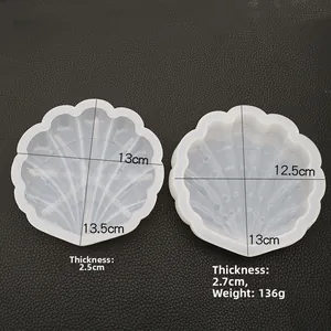 Macro view of two seashell-shaped silicone molds with detailed size measurements