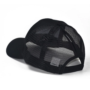 Detail view of the high ponytail slot and breathable mesh on this black cotton baseball cap