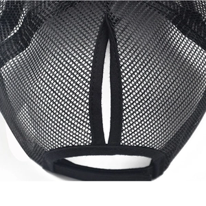 Detail of breathable black mesh back and high ponytail opening on a cotton baseball cap