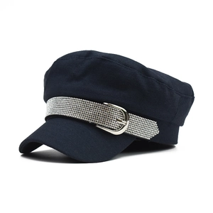 Detail of high-density cotton flat top hat with sparkling rhinestone trim and silver buckle