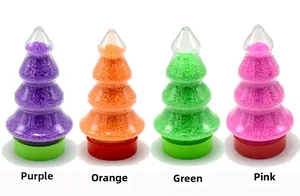 Sable magique hydrophobe en récipients de sapin de Noël en violet, orange, vert et rose