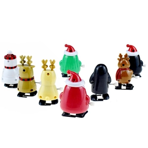 Detail view of mechanical wind-up knobs on Santa and snowman plastic festive toys