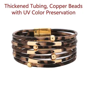 Multilayer wrap bracelet with leopard print pattern and golden copper beads on white background