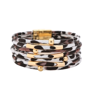 Detailed close-up of leopard print wrap bracelet with golden beads and magnetic clasp