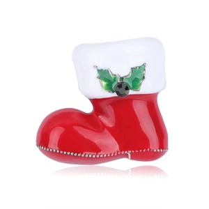 Detail of red Christmas boot brooch with enamel finish and black faceted gemstone