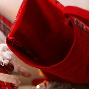 Large festive plaid Christmas stocking with red felt cuff detail for holiday gift bag decor