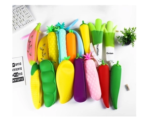Flat lay of colorful silicone pencil cases in creative fruit and vegetable shapes