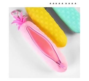 Detail view of pink pineapple silicone pencil case with open zipper and soft texture