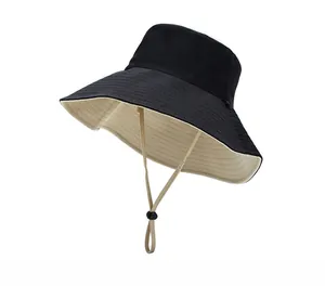 Detail of double-sided bucket hat with adjustable chin strap and wide protective brim