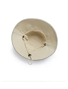 Detail view of the interior of a beige sun hat featuring an adjustable windproof rope