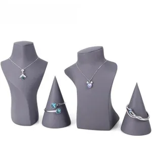 Detailed display of insect pendant necklace and silver jewelry on grey bust stand