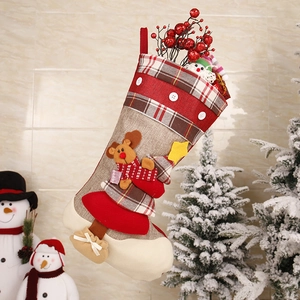Detailed Christmas stocking with reindeer appliqué, linen fabric, and festive plaid patterns