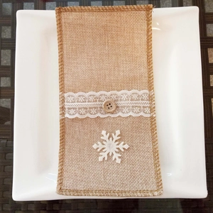 Rustic burlap Christmas cutlery holder with white lace, wooden button, and felt snowflake detail