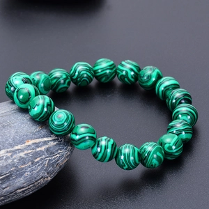 Natural green malachite beaded bracelet on dark stone, handcrafted 6-10mm round gems