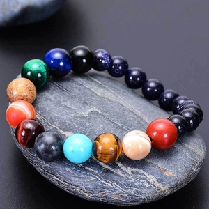 Bracciale pianeti sistema solare con pietra blu sabbia e occhio di tigre su roccia