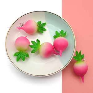 Realistic white and pink gradient carrot pendants with green leaves and metal rings