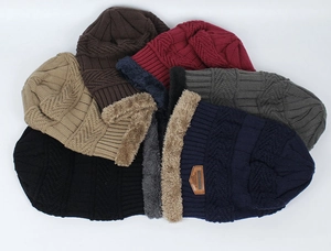 Close-up of thick cable knit winter beanies with soft thermal fleece lining details
