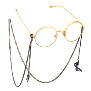 Lunettes rondes dorées avec chaîne métallique noire et pendentifs papillon élégants