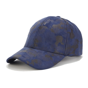 Detailed view of dark blue camouflage baseball cap featuring premium faux suede texture