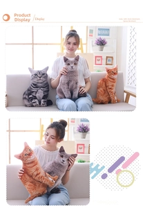 Three 3D realistic plush cat pillows in grey, orange, and tabby patterns in a cozy room