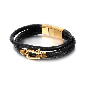 Men's vintage black braided leather bracelet with golden horseshoe magnetic clasp