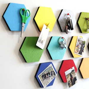Colorful hexagonal felt wall tiles in a creative geometric layout for modern home decor