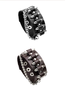 Detail of punk leather bracelets featuring metal studs, chunky chains and snap buttons