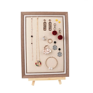 Wooden jewelry display frame with linen lining for earrings necklaces and rings
