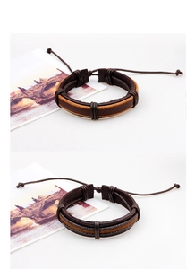 Detail of brown braided leather bracelet with adjustable slide knot and textured layers