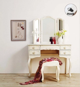 Detail of metal hook accessory for wall-mounted wooden jewelry storage frame