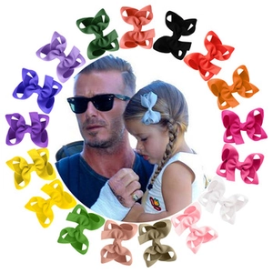 Detail of colorful 4-inch velvet hair bows for children in assorted vibrant colors