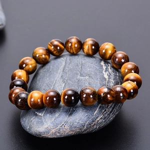 Natural tiger eye stone beaded bracelet with chatoyancy effect on smooth pebbles