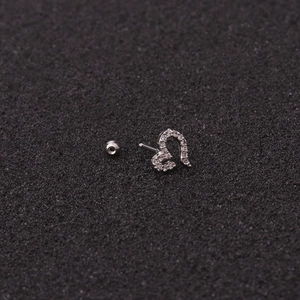 Silver flower stud earring with sparkling zircons and round back on black background