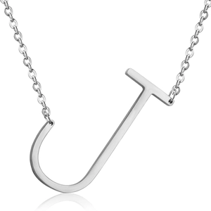 Macro detail of silver stainless steel pendant featuring a capital letter J with reflective finish