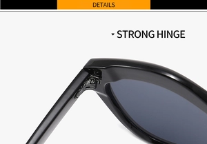 Close-up of the reinforced strong metal hinge on irregular black sunglasses
