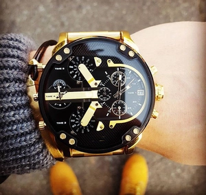 Close-up of gold oversized men's watch with four time zones and black dial