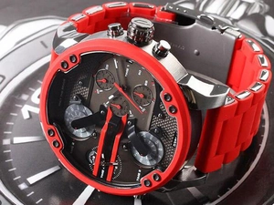 Macro side view of multi-timezone men's watch with red silicone strap and metal details
