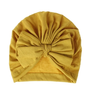 Cappello a turbante giallo senape per neonato con grande fiocco, soffice cotone pettinato