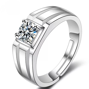 Close-up of men's silver ring with a square-set round zircon and grooved band details