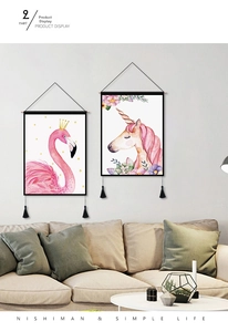 Detail of pink flamingo wall hanging with black tassels and elegant watercolor finish