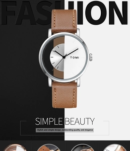 Detailed close-up of a hollow design watch dial with black and white split face texture