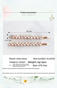 Detail view of wavy rhinestone hair clips showing precise 6cm x 0.7cm dimensions