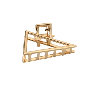 Minimalist gold geometric triangle metal hair claw clip with glossy finish on white background