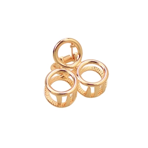 Minimalist gold alloy circular hair claw clip for women with a sleek geometric metal finish