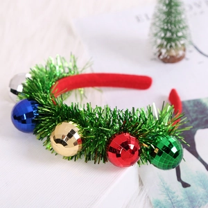Christmas tinsel headband with colorful disco balls and bells on a festive background
