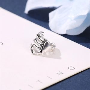 Punk style skeleton hand ear cuff in antique silver finish with gothic bone texture