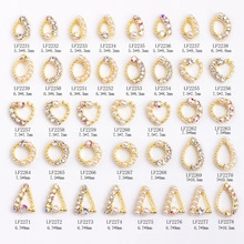 Detailed grid of 40 mixed nail art charms featuring alloy bases with crystals and pearls